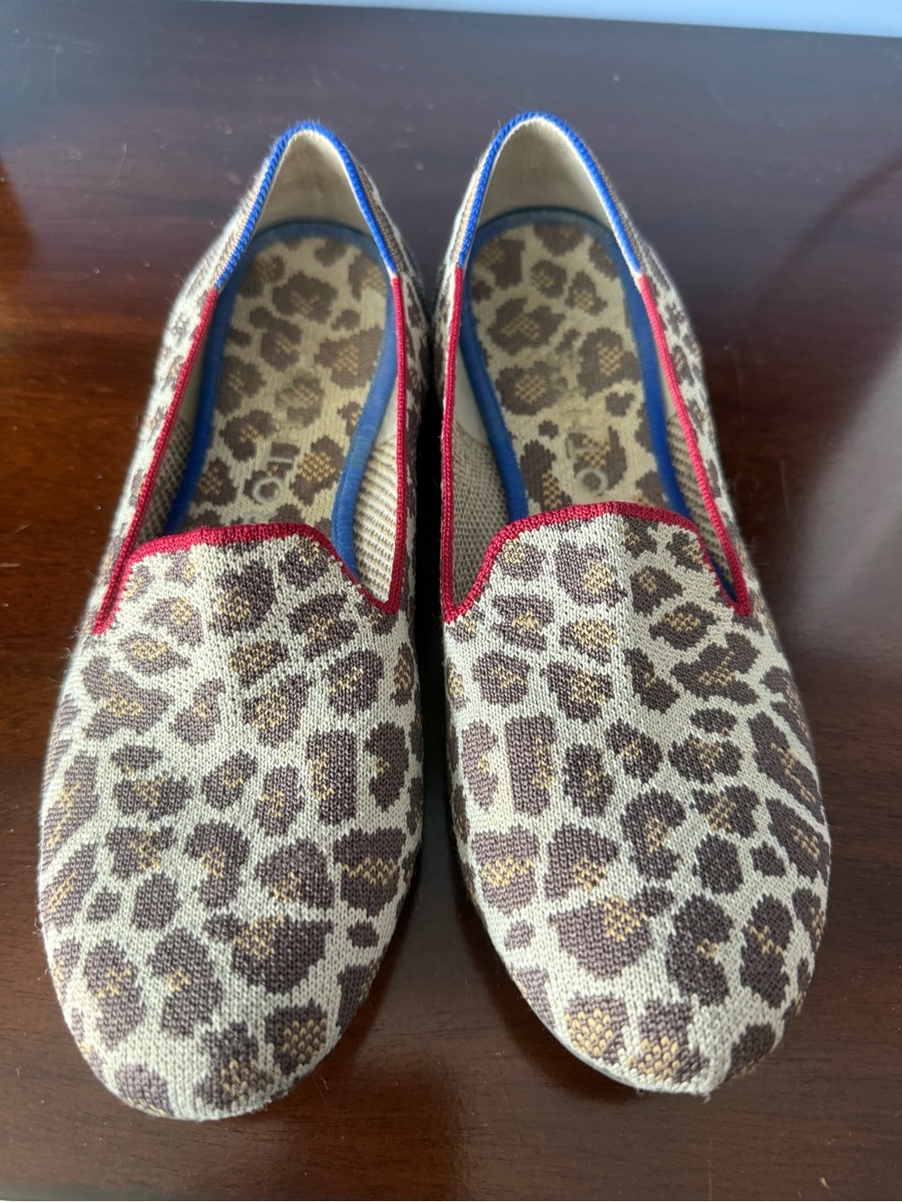 Rothy’s Leopard Print Slip-On Flats with Blue & Red Trim
